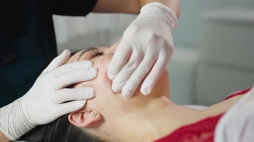Woman Receiving Face Massage at Health Spa