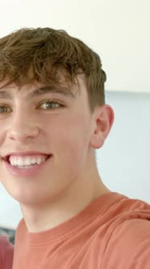 Portrait of a Smiling Teenage Boy With Green Eyes