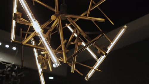 Modern brass light fixture with light bulbs