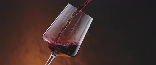 Red Wine Pouring into Wine Glass