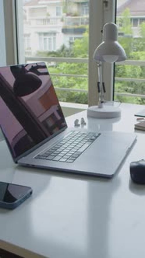 Office Desk with Laptop, Smartphone and Lamp