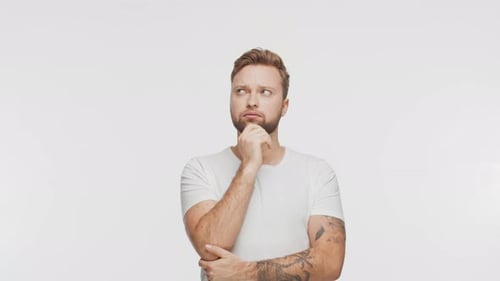 Thinking Young Man Over Vibrant Background Studio Portrait of Expressive Handsome Person