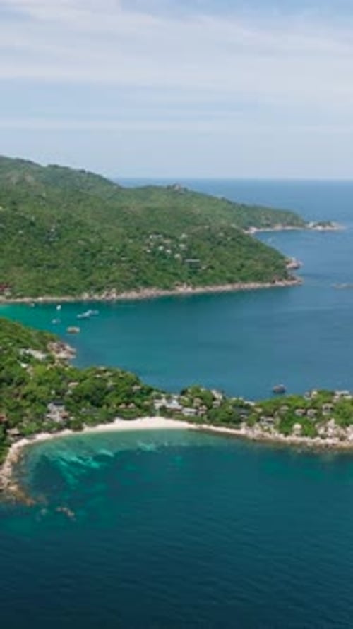 Tropical Island with Clear Blue Waters and Rocky Coastline Koh Tao Thailand