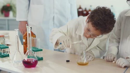 Children Doing Science Experiments in a School Laboratory