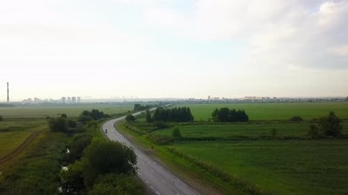 Aerial View of Motorcycle Riding on Country Road Clip