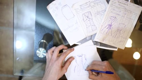 Designer Drawing Sketches for Clothes Hipster Designer Working in Tailor Studio Sketching a Fashion