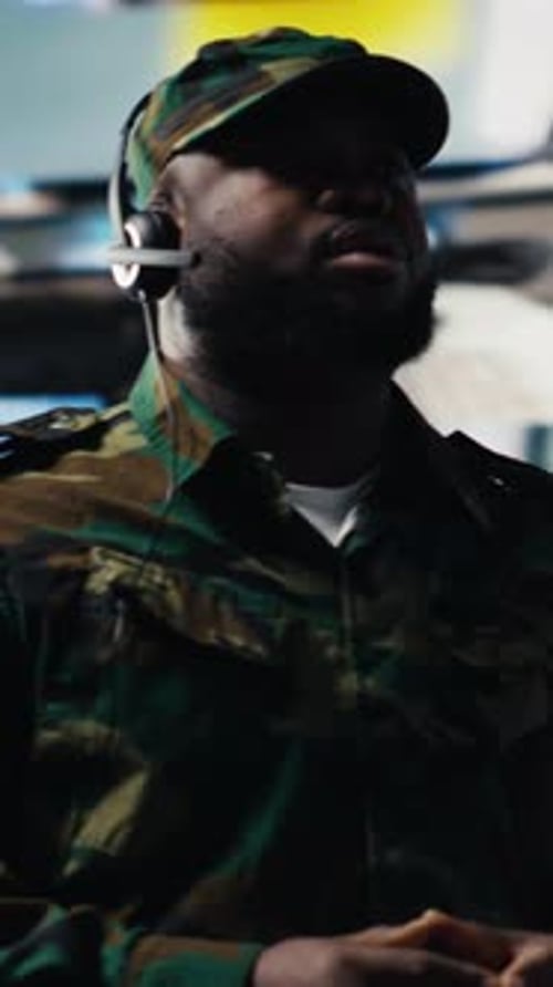 Soldier in Camouflage Jacket Gives Orders