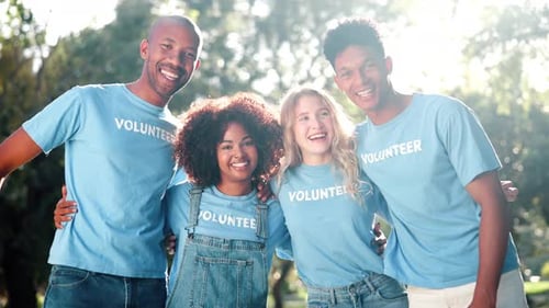 Cheerful Volunteers Smiling Together in Sunny Park