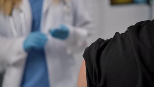Healthcare Professional Administering Vaccine Injection Safely
