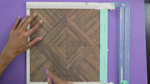 Crafting: Scoring Paper With Tool On Purple Background