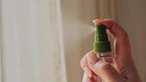 Close-up of a woman spraying antiseptic. High quality 4k footage