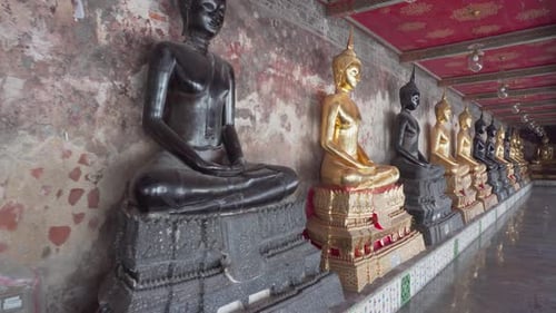 Awesome row of Buddha statues in Wat Suthat Thepwararam, Bangkok