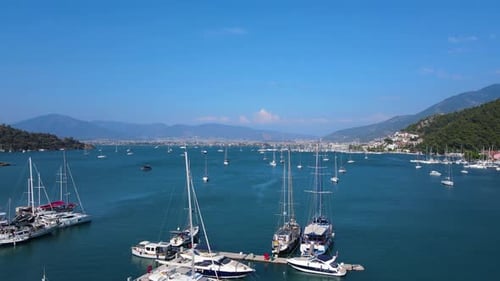 Beautiful view of the beach with boats, pure nature, sea and ships. Shot from a drone.