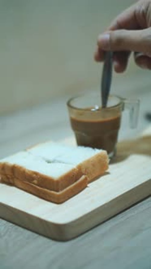 Simple Breakfast Bread and Coffee Preparation Indoors
