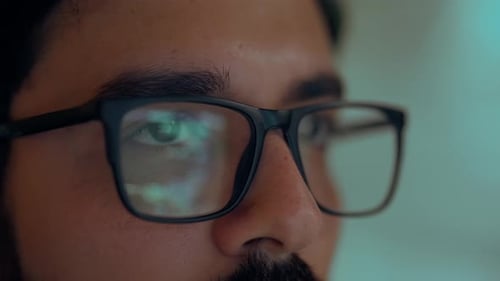 Adult Man Wearing Glasses Looking At Computer Screen