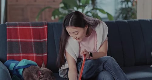 Young Woman Relaxing with Her Dog
