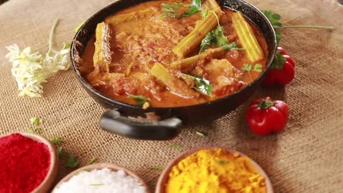 Delicious Drumstick Curry Simmering on Burlap Sack