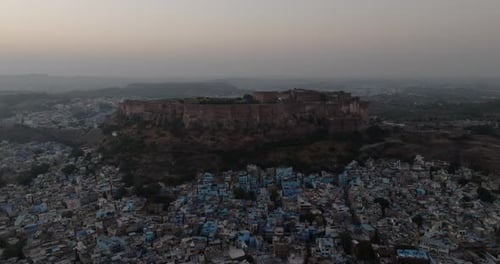 Aerial view of mehrangarh fort and blue city at dusk, India.
