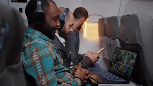 Entrepreneur Talking on Videocall Conference on Airplane