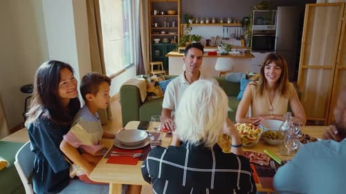 Friends and Family Gather for Meal at Home