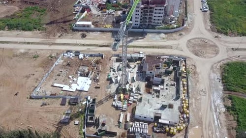 Large residential construction site with cranes, Aerial view