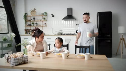 Family Enjoys Breakfast in Bright Modern Kitchen