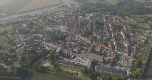 Aerial view of historical fort city and river, France.