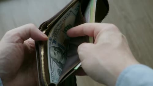 Opening Leather Wallet Containing Paper Currency