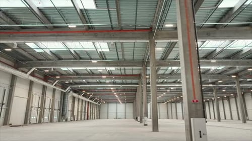 Empty Warehouse Interior of Industrial Building with Steel Constructions Horizontal Drone Footage of
