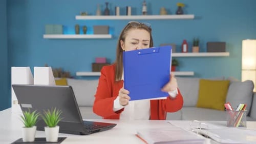 Home office worker woman is aggressive and addicted to violence.