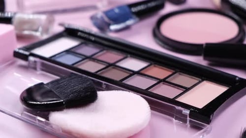 Rotating Background with Decorative Cosmetics Blush Concealer Powder Shadows Nail Polish Makeup