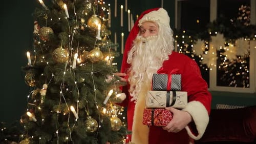 Santa with Gifts by the Christmas Tree