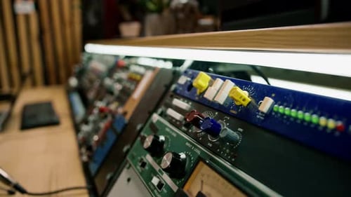 Sound engineer using digital audio mixer sliders Engineer pressing keys adds control panel volume
