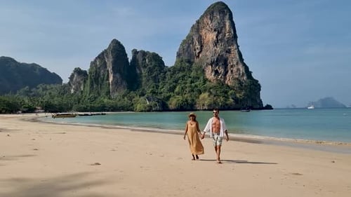Strolling Hand in Hand Along the Serene Shores of Railay Beach in Krabi Thailand