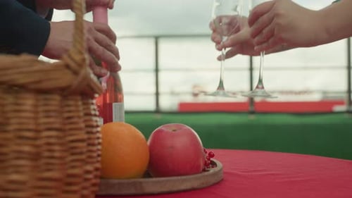 Picnic with Wine and Fruit on Rooftop