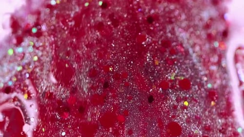 Glitter and Red Liquid Abstract Background