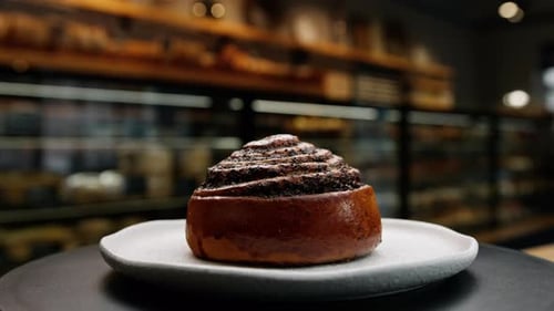 Close-up, bakery - poppy seed bun on a rotating surface