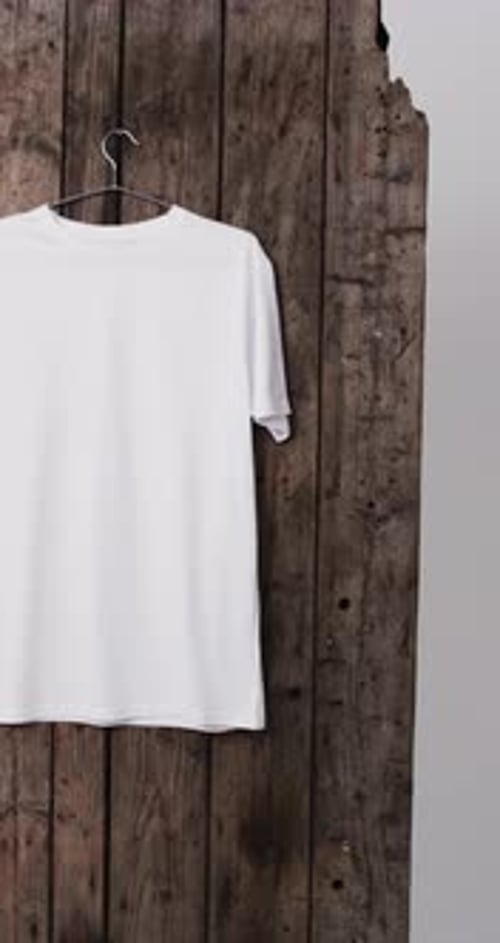 Plain White T-Shirt on Wooden Background