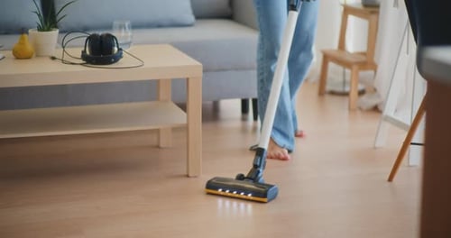 Woman Vacuuming Her Living Room