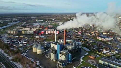 Industrial factory in small township, aerial drone view