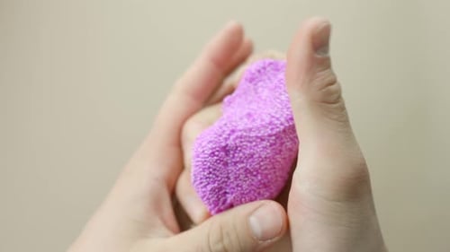Close-Up: Kneading Pink Floam Slime for ASMR with Beige Background