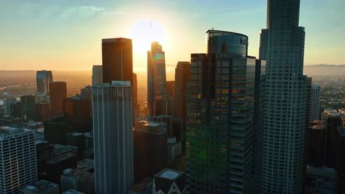 Skyscrapers' tops in the midtown of Los Angeles, California, USA. Bright sun lights the scenery.