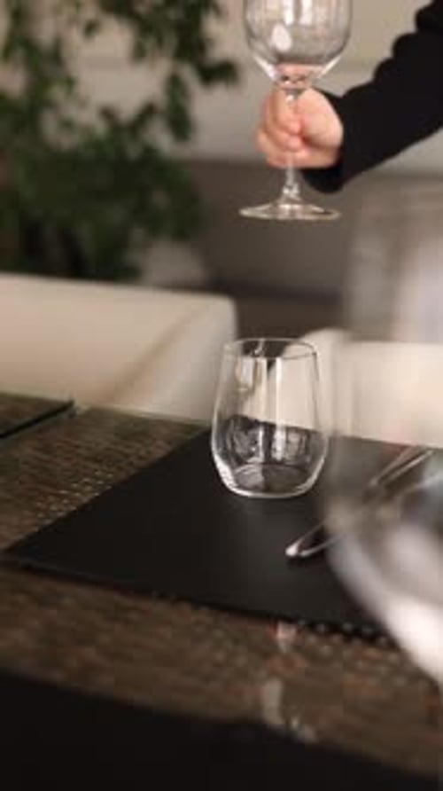process of table setting for a banquet in a restaurant
