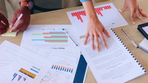 Reviewing Data and Charts in a Corporate Meeting