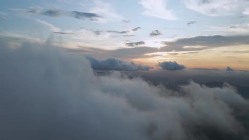 Aerial View of Clouds at Golden Sunrise