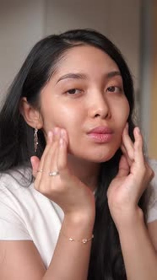 Woman Applying Skin Cream for Beauty and Wellness