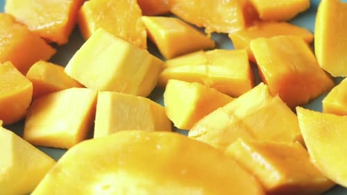Yellow Ripe Cut Mango in a Bowl Top Down