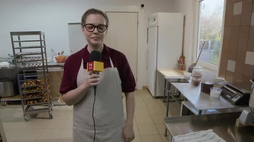 Pastry Chef Giving Interview by Stand Mixer in Professional Kitchen