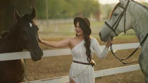 Woman and Horses Together on a Sunny Ranch