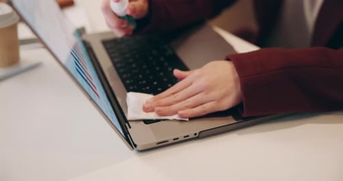 Hands, worker and spray sanitiser on laptop in office for keyboard hygiene